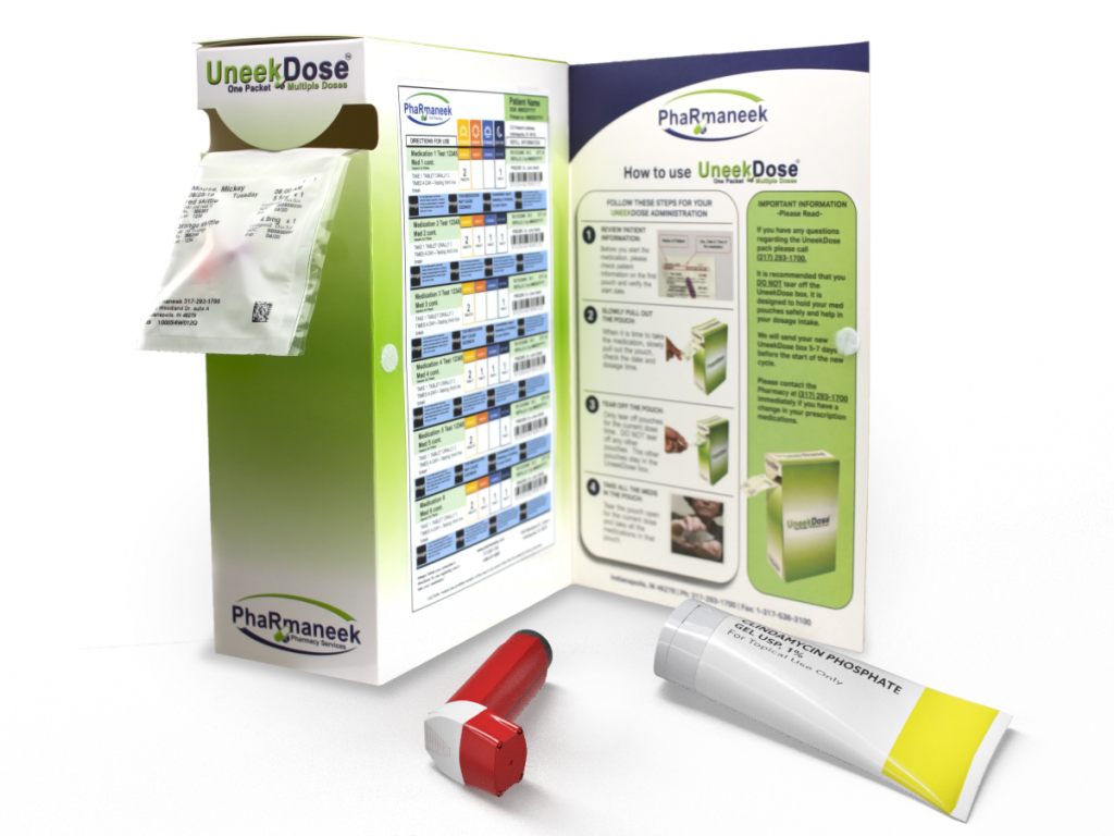 UneekDose packaging system showing organized medication packets, instructions, and pharmacy products